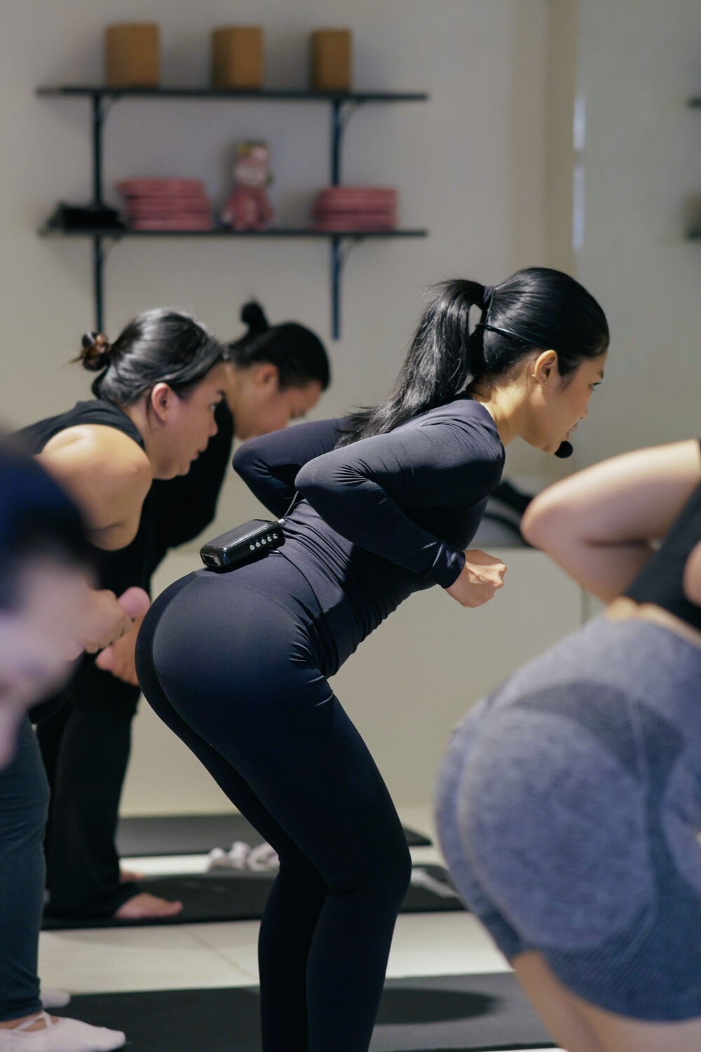 Keisha coaching a class, cueing a movement mid-session
